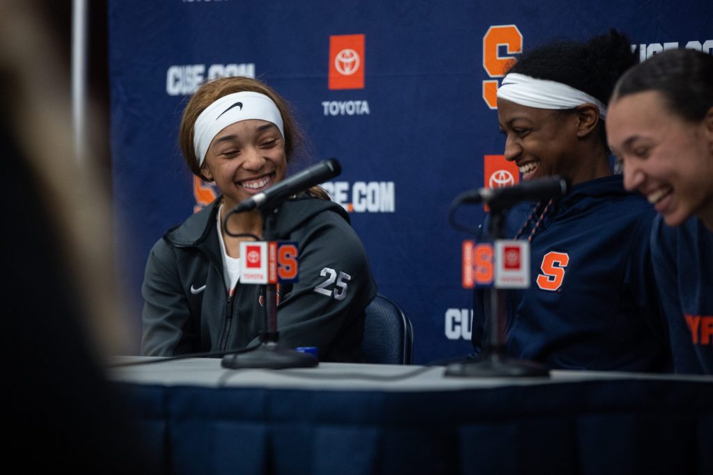 Alaina Rice (left), Teisha Hyman (center), and Najé Murray (right) laugh during the postgame press conference on Sunday.