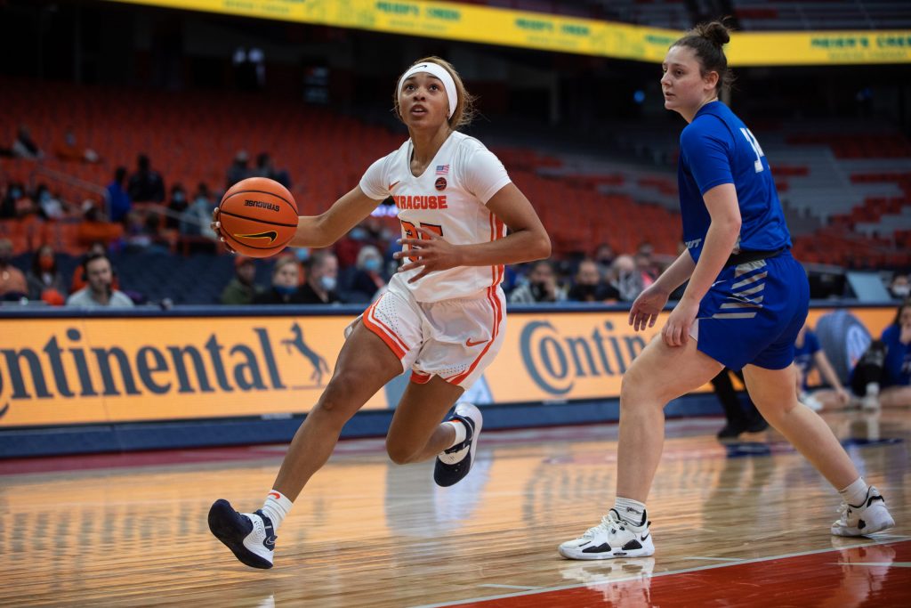 Alaina Rice drives past a Central Connecticut State defender on Sunday at The Dome.