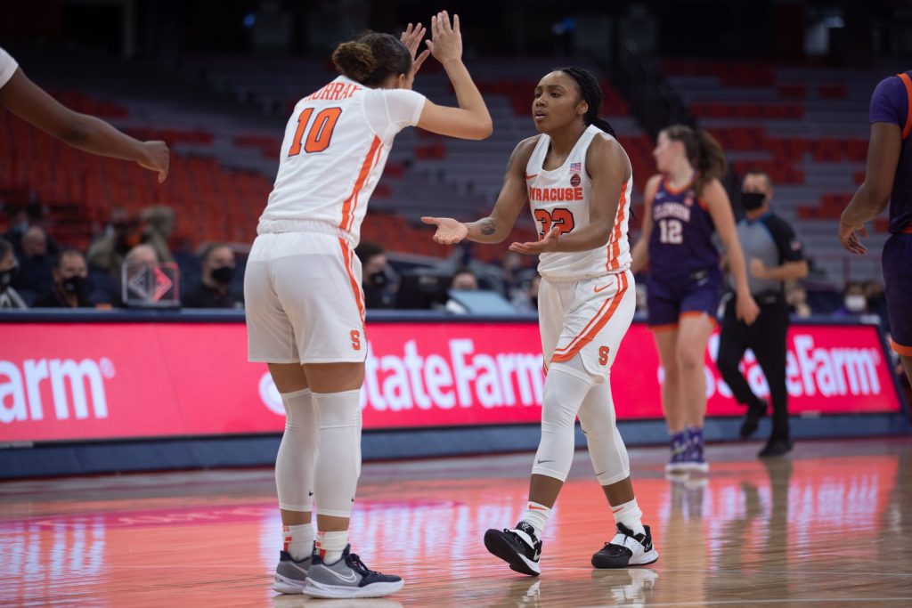 Syracuse's Najé Murray (10) and Chrislyn Carr (32) slap hands once their victory was sealed on Saturday.
