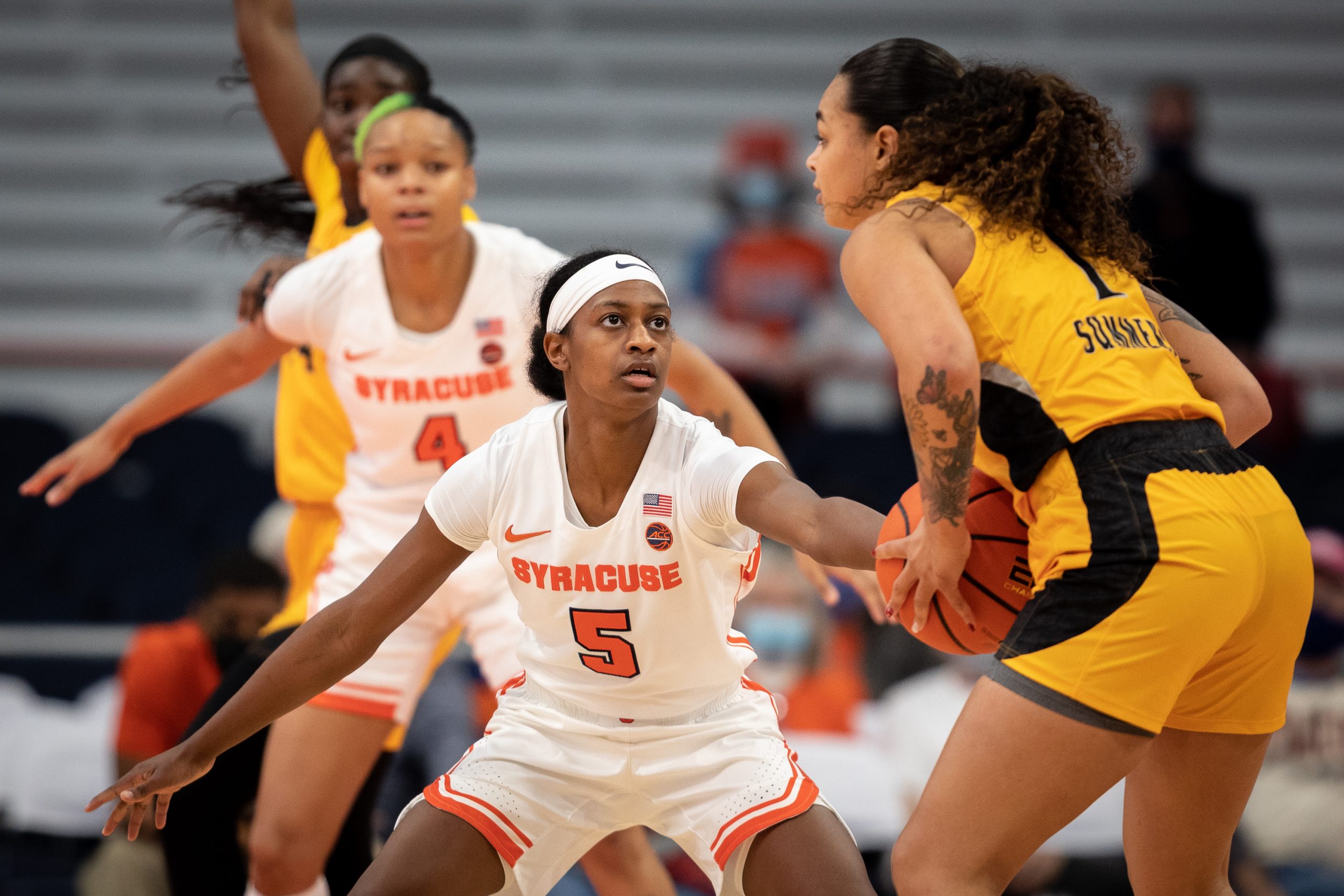 Syracuse guard Teisha Hyman (5) guards UMBC's Janee'a Summers at the top of the 3-point arc on Saturday.