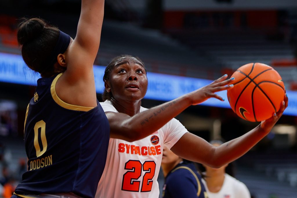Syracuse's (22) Eboni Walker attempts a shot under Notre Dame's (0) Maya Dodson during a Women's Basketball game at the Carrier Dome on November 14, 2021.