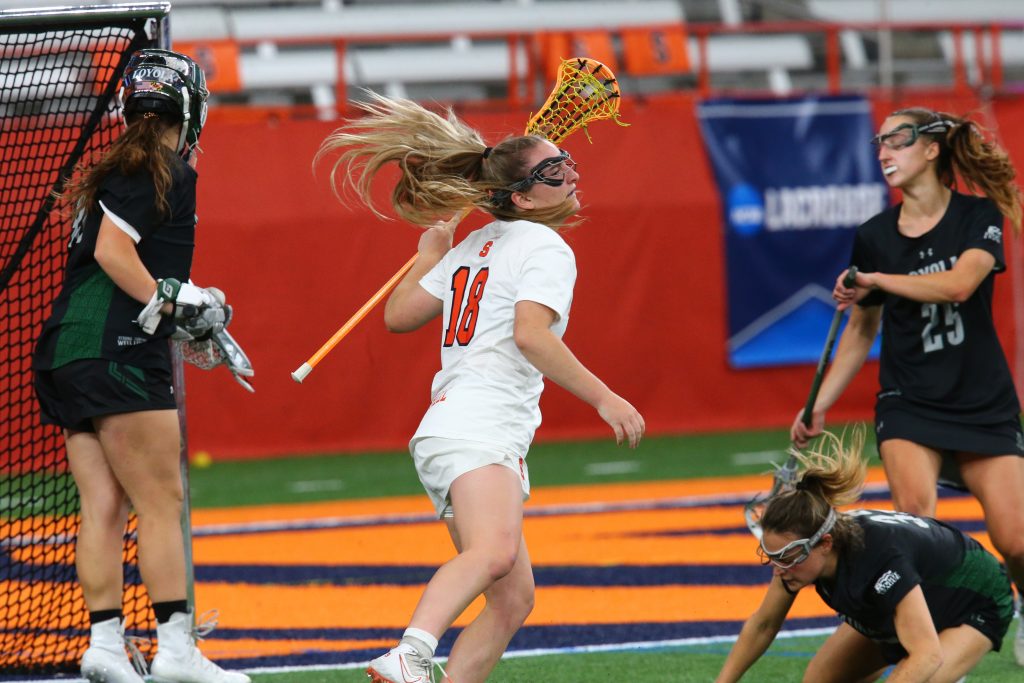 Meaghan Tyrrell (18) scores one of her seven goals against Loyola in the second round of the NCAA Tournament.