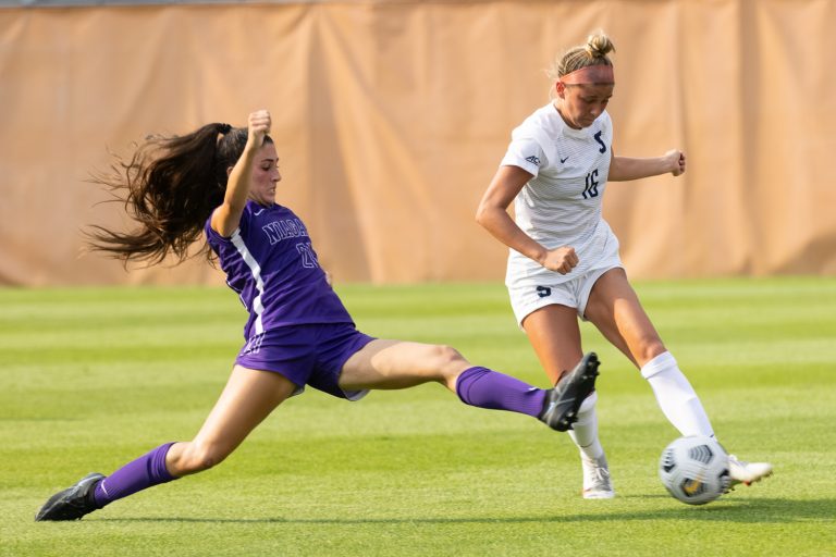 Niagra’s Ida Miceli comes flying in for a slide tackle to try and take possession away from Syracuse’s Koby Commandant (16) during an NCAA women’s soccer game, Thursday, at Syracuse Soccer Stadium. Niagara defeated Syracuse, 4-2