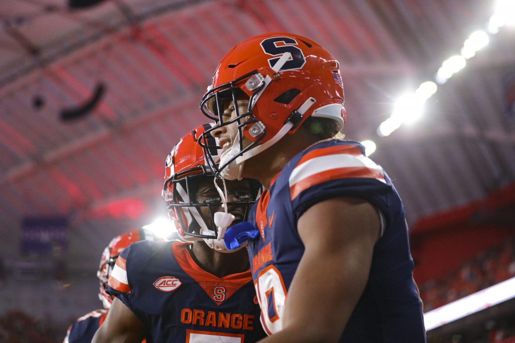 Syracuse's Oronde Gadsden, right, smiles and celebrates his touchdown catch with Anwar Sparrow in the end zone.