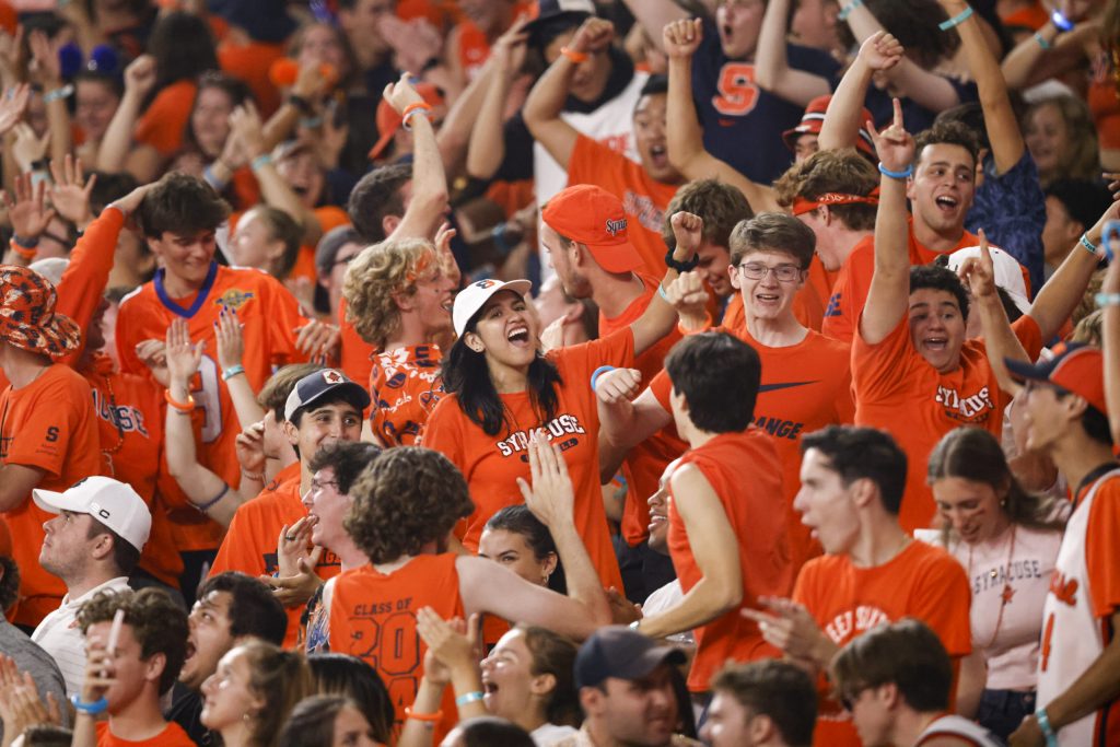 The Syracuse student section cheer on the Orange as they near a season-opening win against Louisville.