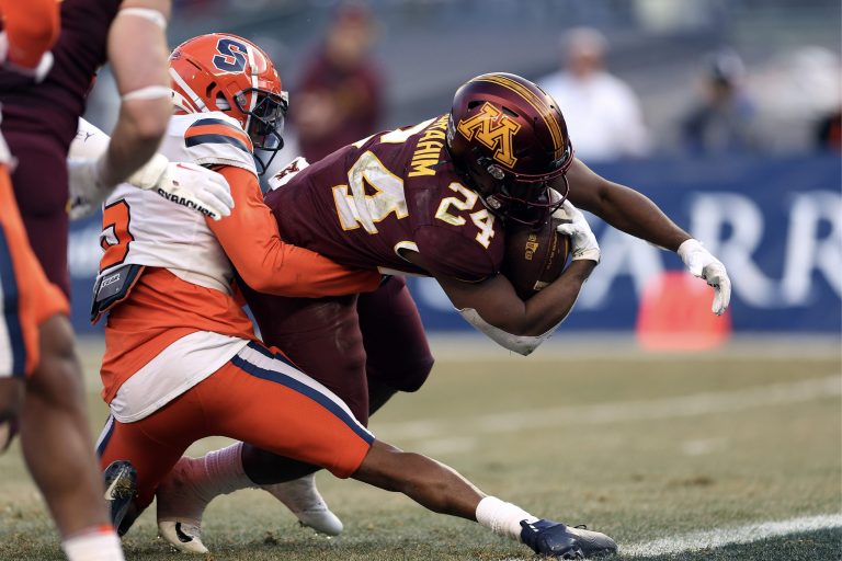 Running back Mohamed Ibrahim #24 of the Minnesota Golden Gophers crosses the goal line for a touchdown during the 1st half of the Bad Boy Mowers Pinstripe Bowl against the Syracuse Orange at Yankee Stadium on December 29, 2022 in New York City.