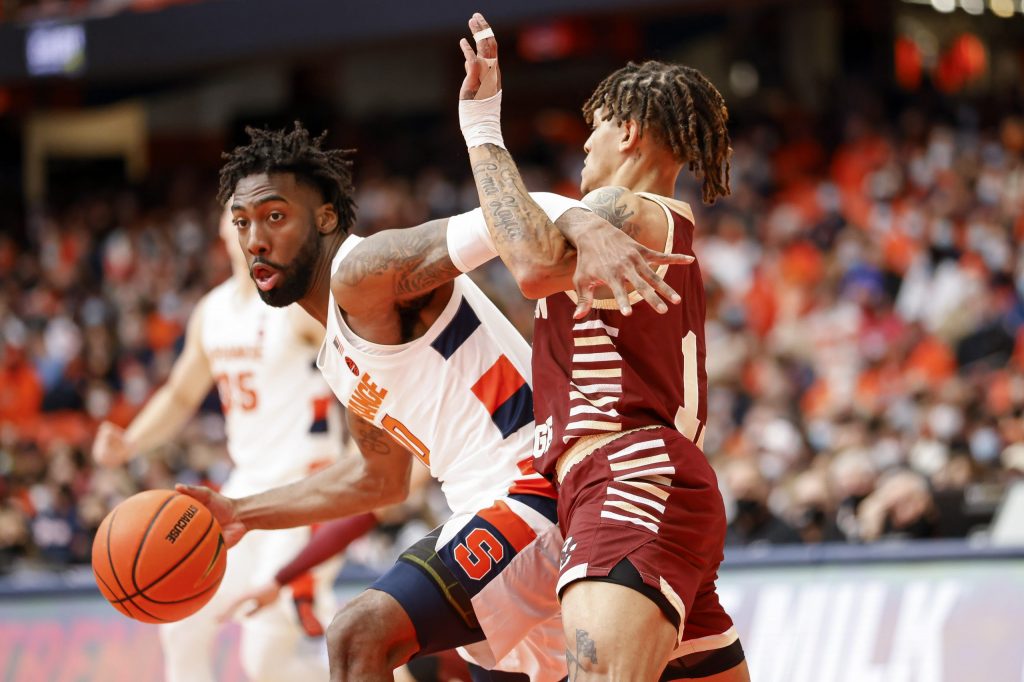 Syracuse's Symir Torrence, left, makes a move in the post against Boston College's Makai Ashton-Langford.