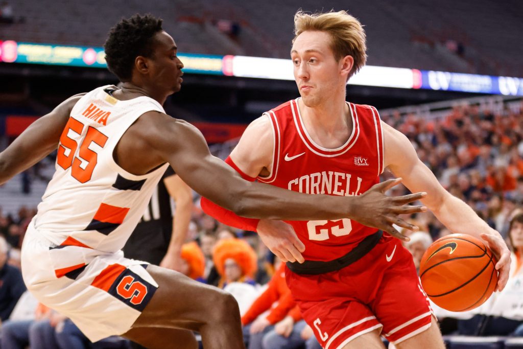 Cornell's Max Watson, right, tries to drive the baseline against Syracuse's Mounir Hima.