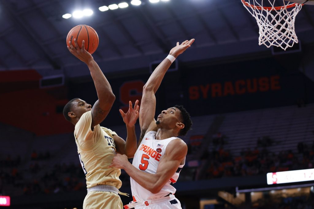Syracuse's Frank Anselem (5) winds up to swat away a shot from Georgia Tech's Jalon Moore.