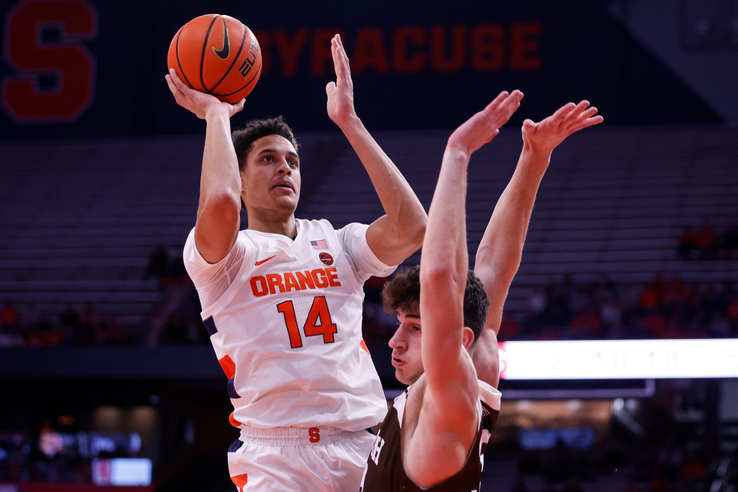 Syracuse's Jesse Edwards (14) rises above Lehigh's Dominic Parolin two points during an NCAA men's basketball game on Tuesday at JMA Wireless Dome.