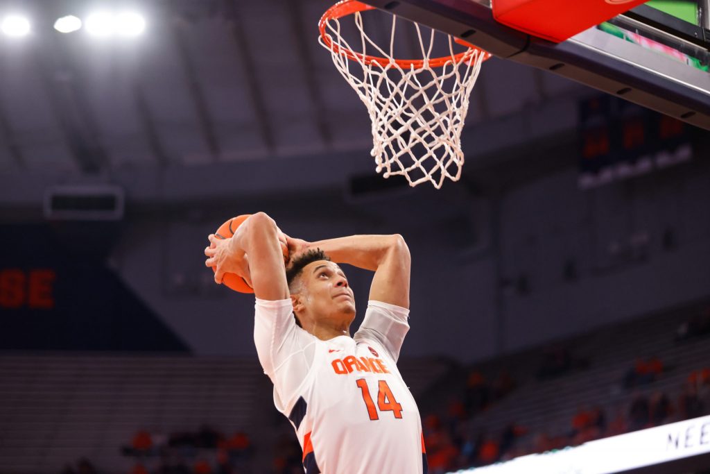 Syracuse's Jesse Edwards winds up for a dunk against Northeastern.
