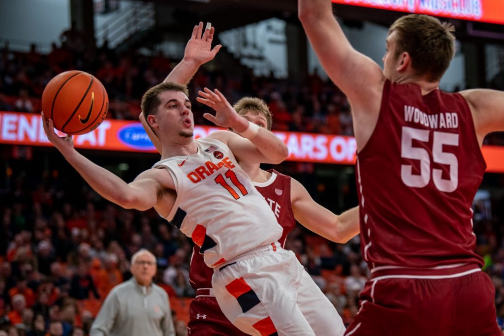 SU's Joseph Girard (11) attempts to make a pass along the baseline in their loss to Colgate on November 15th, 2022.