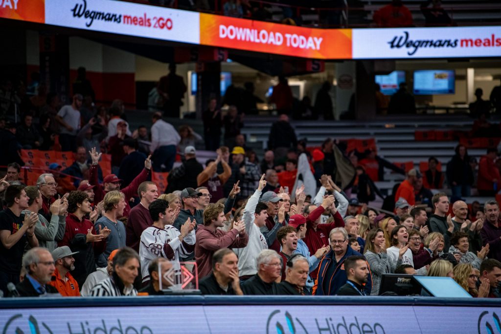 Colgate Fans behind the team's bench celebrate after a pivotal bucket in the second half on November 15, 2022.