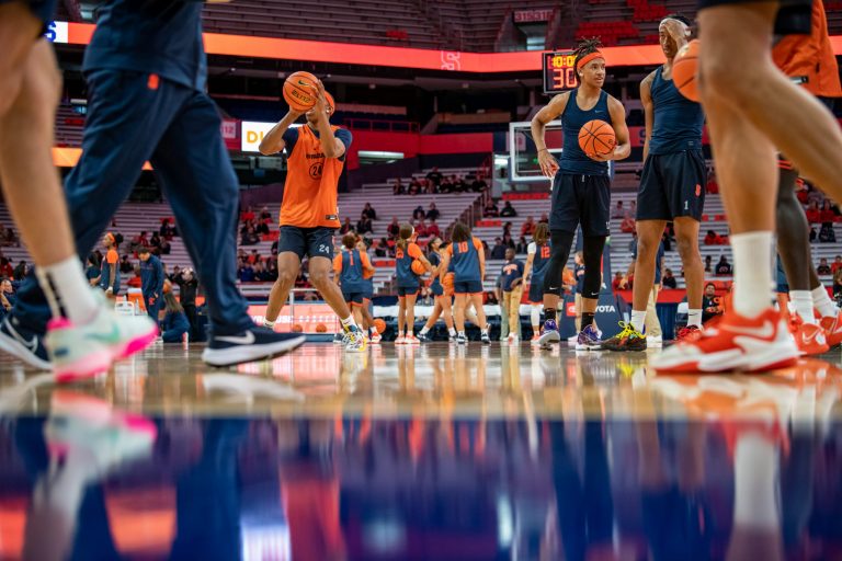 Both mens and womens basketball teams warmup on the court at the Orange Tip Off fan event. Photo by Ryan Brady. 10/14/22