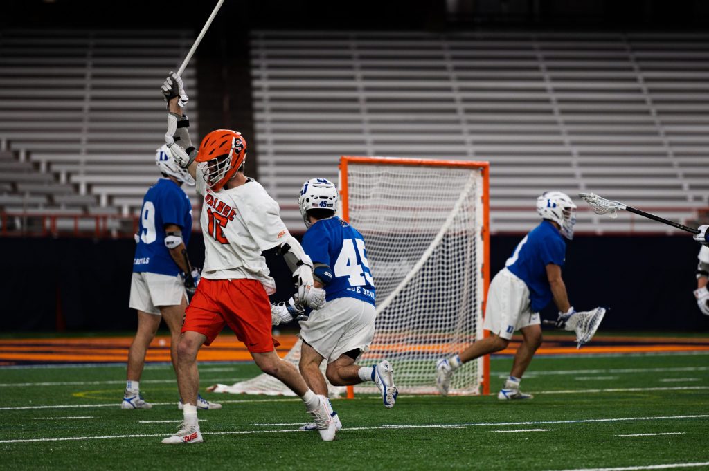 Brendan Curry (No. 16) celebrates after a goal in SU's victory over Duke on March 26th, 2022.