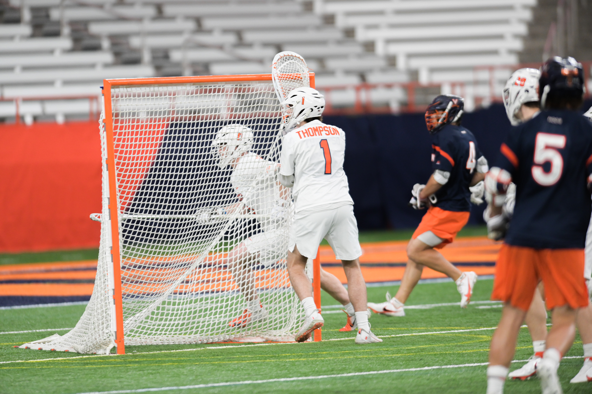 Syracuse goalie Harrison Thompson defends the cage during the Orange's match vs. Virginia in the Carrier Dome on April 23, 2022.
