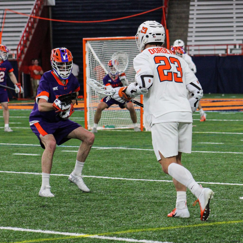 SU's Tucker Dordevic gets ready to dodge on a Hobart defenseman at The Dome on Sunday.