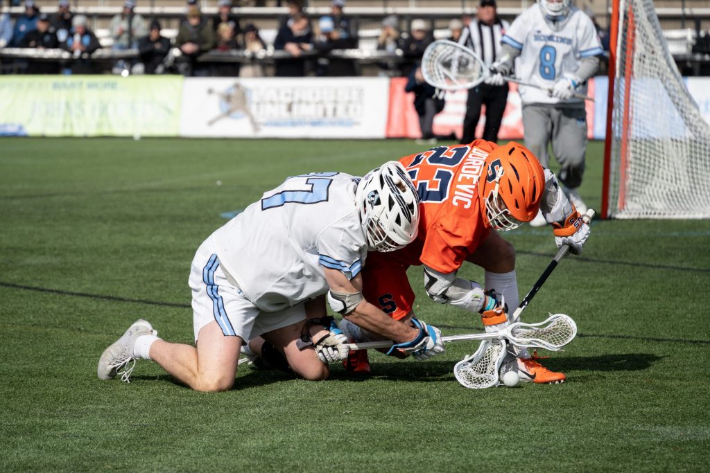 Junior Captain Tucker Dordevic fights for a ground ball. SU vs. Johns Hopkins - Lacrosse - March 13, 2022 - Baltimore, Maryland