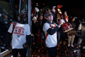 eorgio Kocevski #8 of the Syracuse Orange hoists the NCAA trophy during the Men’s Soccer arrival at the John A Lally Athletics Complex on December 13, 2022 in Syracuse, New York.