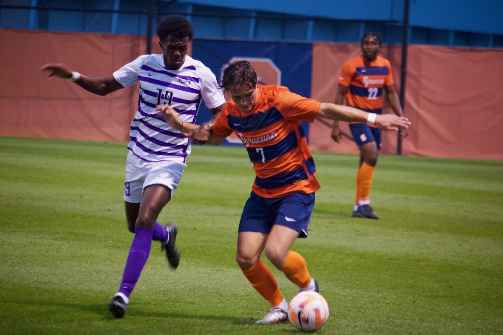 Syracuse midfielder Curt Calov (7) fights for possession of the ball from Niagara's Asher Barnes (19) during an ACC men's soccer game at SU Soccer Stadium on Tuesday, September 13, 2022.