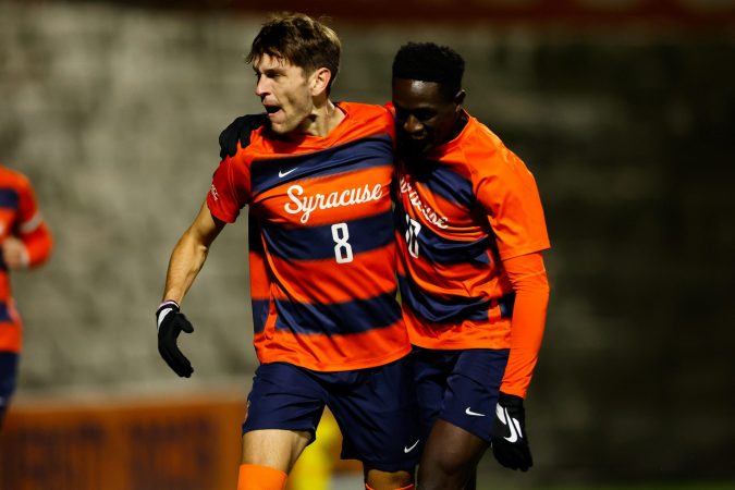 Syracuse's Jeorgio Kocevski (8) and Nathan Opoku (10) celebrate a goal in their win over Wake Forrest on Friday Night.