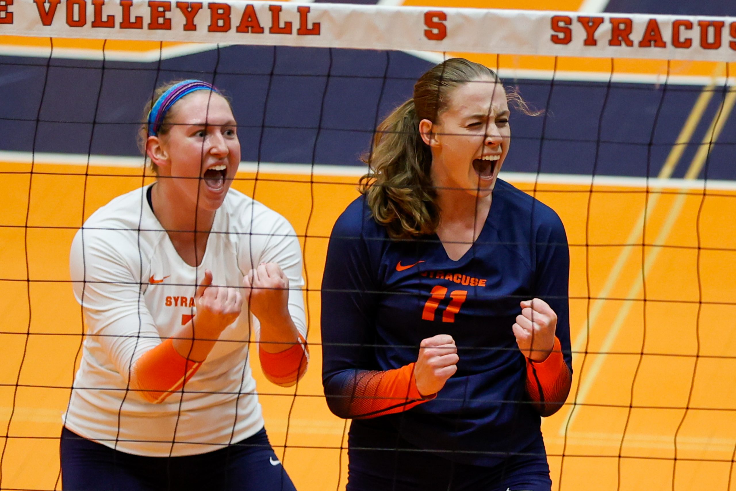 SYRACUSE, NY: Alyssa Bert #3 of Syracuse Orange and Polina Shemanova #11 of Syracuse Orange celebrate a point scored against the Yale Bulldogs during a women’s volleyball match at the Women’s Building at Syracuse University on September 9, 2022.