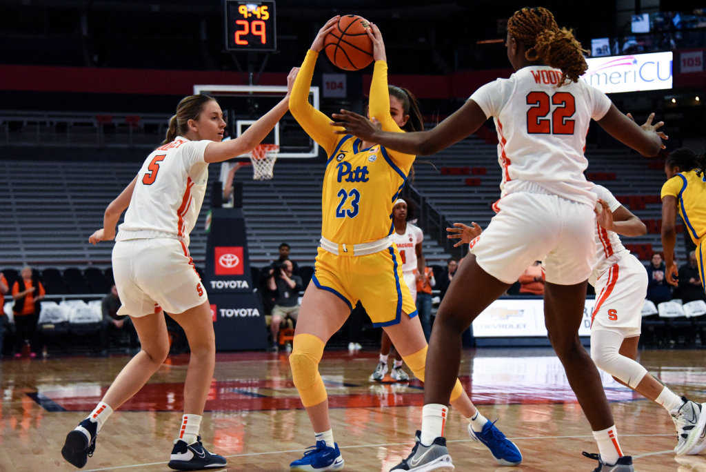 SU forward Kyra Wood and shooting guard Georgia Woolley defend Pitt's Avery Strickland at the JMA Wireless Dome.