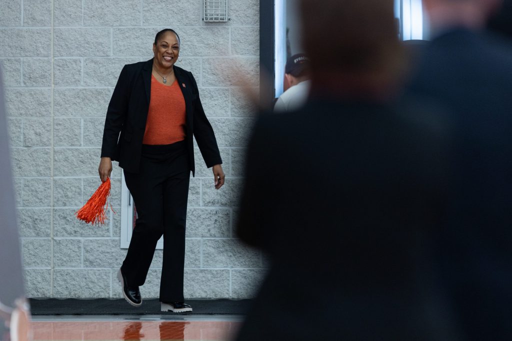 New SU womens' basketball head coach, Felisha Legette-Jack, walks into the Melo Center as head coach for the first time on March 28th 2022.