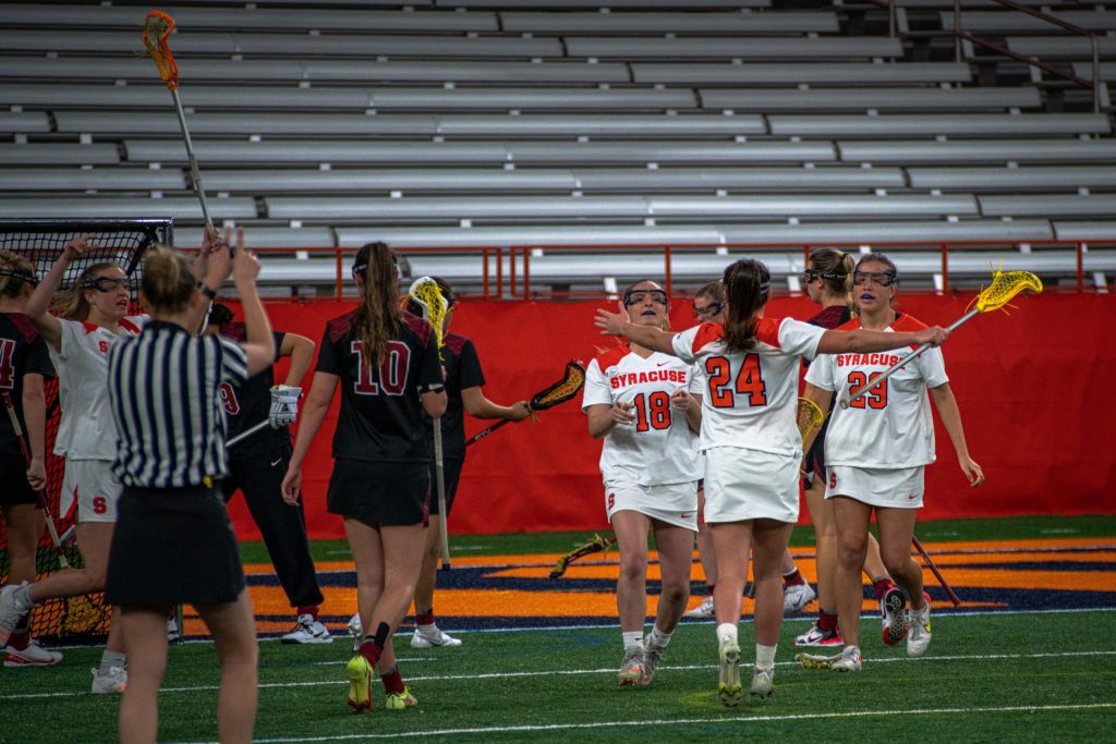 Meaghan Tyrrell (No. 18)Emma Tyrrell (No. 24), Jalyn Jimerson (No. 29) celebrates during Syracuse women's lacrosse win over Temple on March 26, 2022