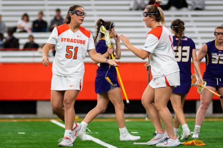 Emily Hawryschuk (51) celebrates her school-record-setting goal against UAlbany during the Women's Lacrosse game in the Dome at Syracuse University at Syracuse, New York on April 19, 2022.