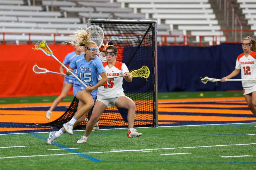 Bianca Chevarie (45) defends the net against UNC attackerduring Syracuse vs. UNC women's lacrosse game on April 9, 2022, in the Carrier Dome.