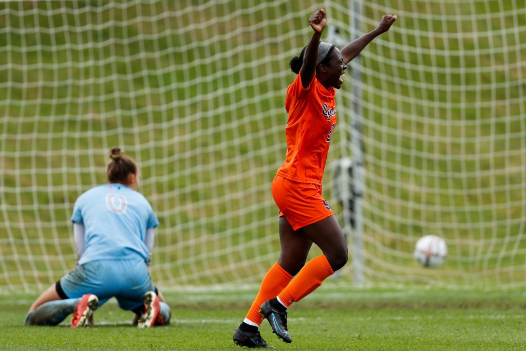 SYRACUSE, NY - SEPTEMBER 25: Chelsea Domond #21 of Syracuse Orange celebrates after scoring the first goal against the Miami Hurricanes at SU Soccer Stadium on September 25, 2022 in Syracuse, New York. (Photo by Isaiah Vazquez)