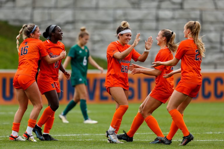 SYRACUSE, NY - SEPTEMBER 25: The Syracuse Wiomen’s Soccer team celebrates after Chelsea Domond #21 of Syracuse Orange scores the first goal against the Miami Hurricanes at SU Soccer Stadium on September 25, 2022 in Syracuse, New York. (Photo by Isaiah Vazquez)