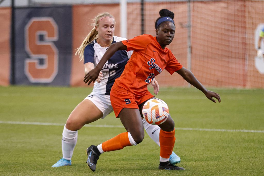 Syracuse's Chelsea Domond, right, shields away New Hampshire's Delaney Diltz to keep away possession during a non-conference women's soccer game on Thursday at SU Soccer Stadium.