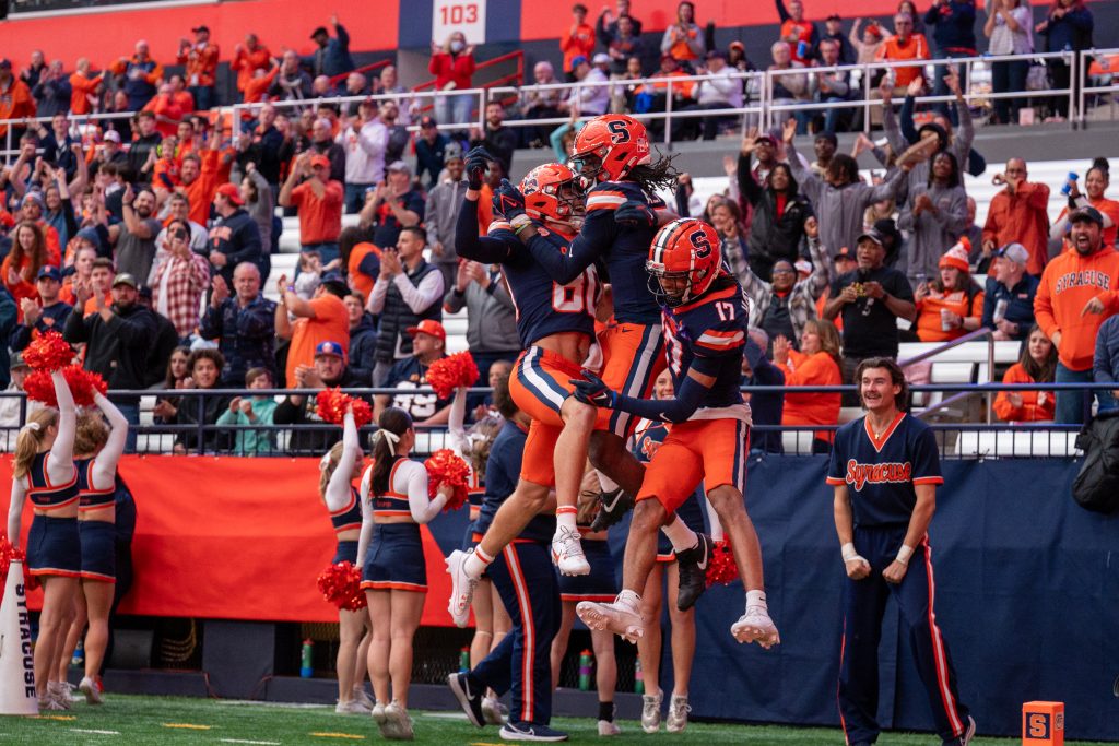 Syracuse Orange players celebrate a 75 yard drive for a touchdown at Saturday's game against Wake Forest.