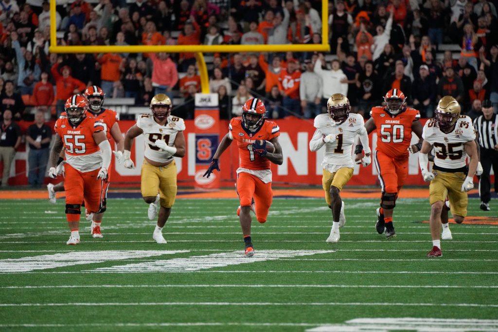 LeQuint Allen (#1) sprints down the field for a 56-yard gain, breathing some life back into Syracuse fans at Friday's game.