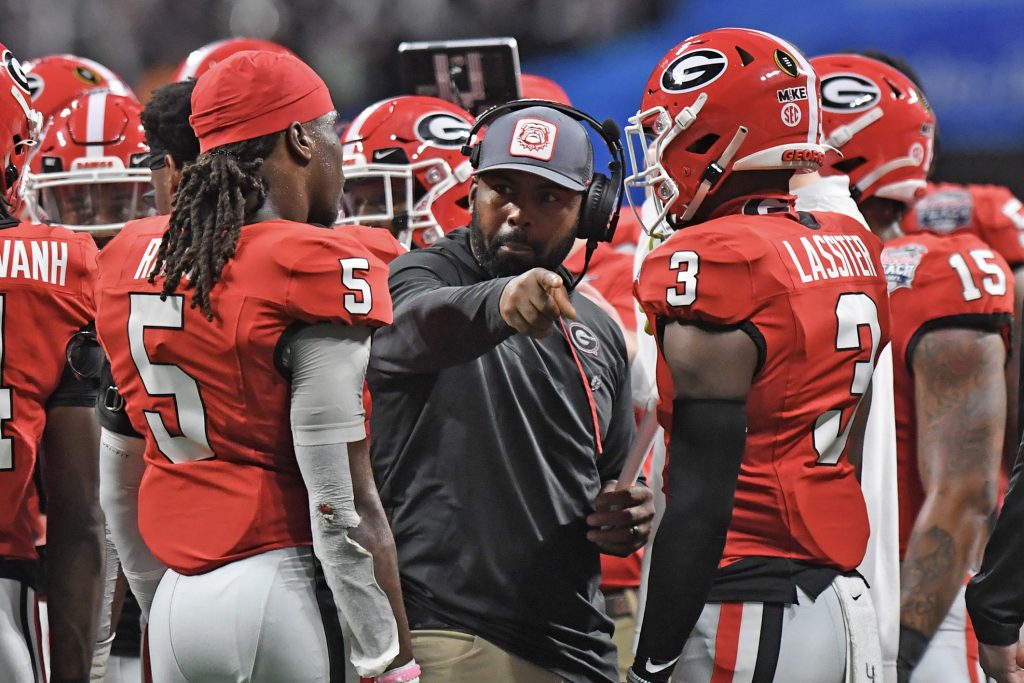 Fran Brown (center), shown here among his Georgia football players at the 2022 Chick-fil-A Peach Bowl College Football Playoff Semifinal game.