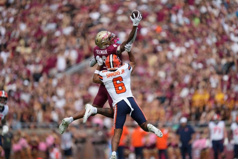 Florida State Seminoles wide receiver Keon Coleman (4) makes a leaping one handed catch over Syracuse Orange defensive back Jason Simmons Jr. (6) in the first half during the game between the Syracuse Orange and the Florida State Seminoles on Saturday, October 14, 2023 at Bobby Bowden Field at Doak Campbell Stadium, Tallahassee, Fla