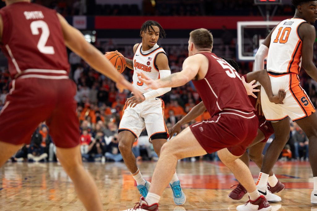 Syracuse's Judah Mintz (#3) plays off of a screen set by Naheem McLeod (#10) at Tuesday's game.