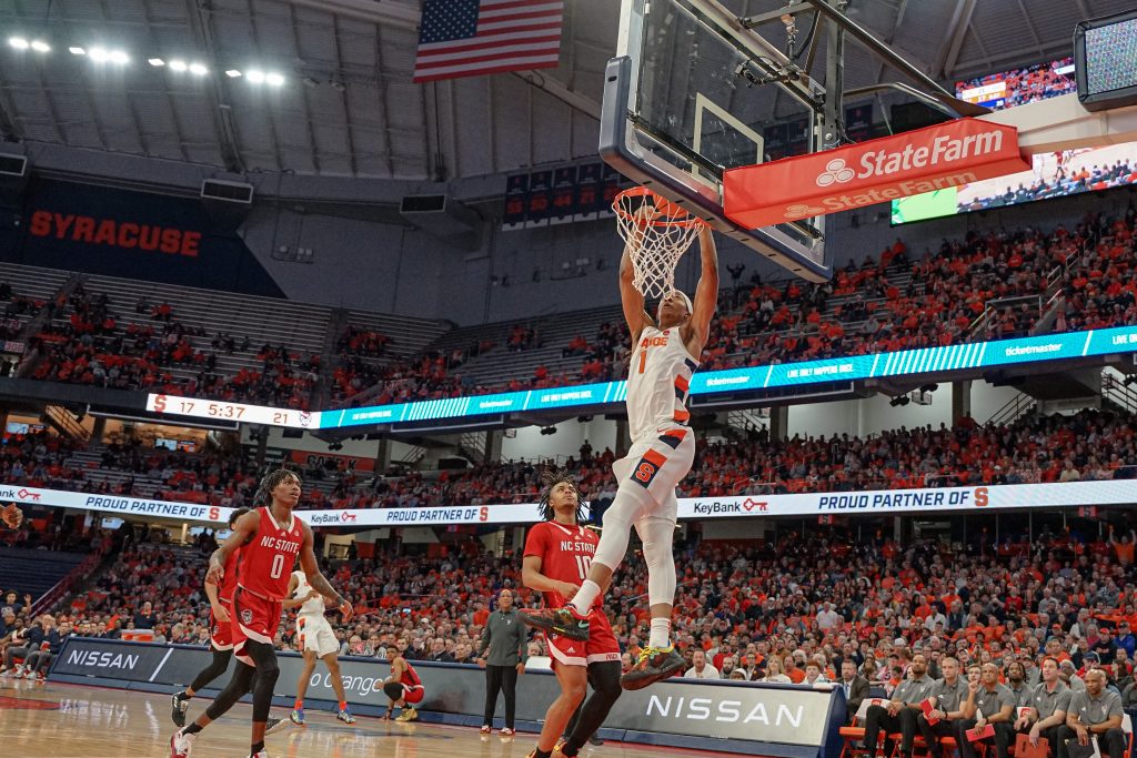 Maliq Brown (1) with a big dunk against the NC State Wolfpack on Feb. 14, 2023, at the JMA Wireless Dome.