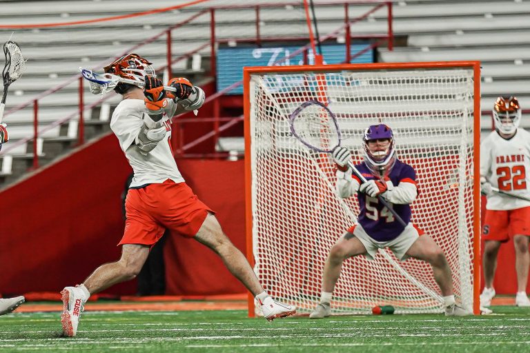 Syracuse University Lacrosse Player Luke Rhoa takes a shot on goal