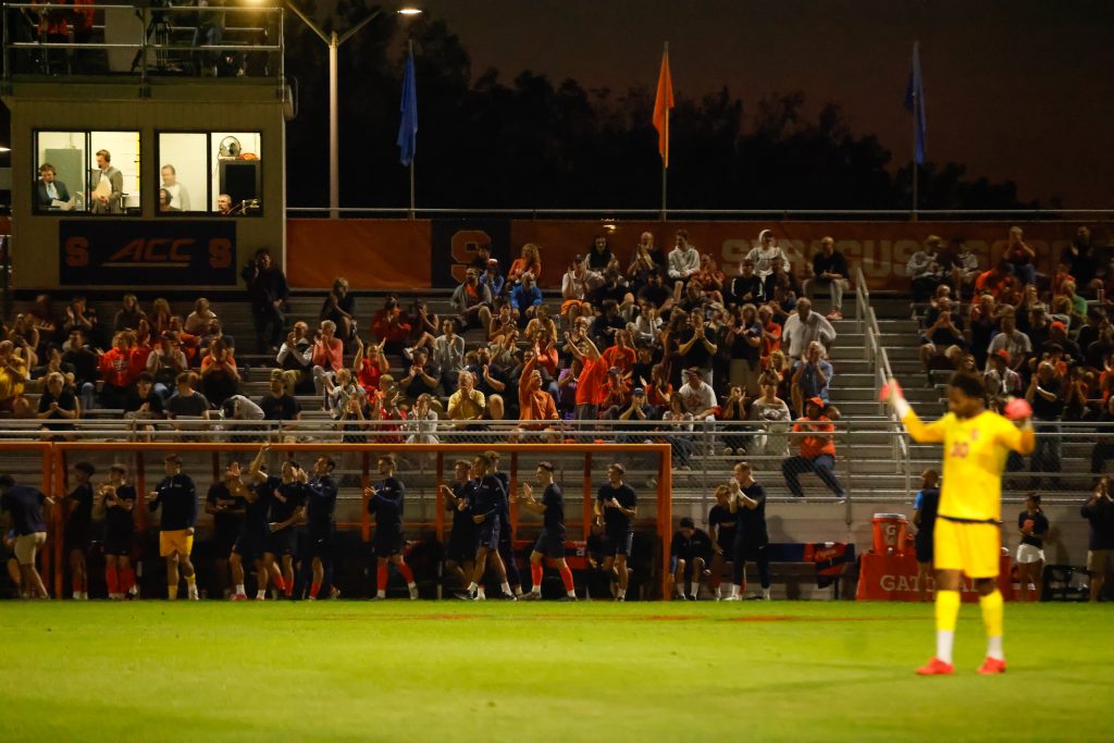 Syracuse men's soccer fans celebrate a goal against Colgate on Tuesday, October 3, 2023 at SU Soccer Stadium.