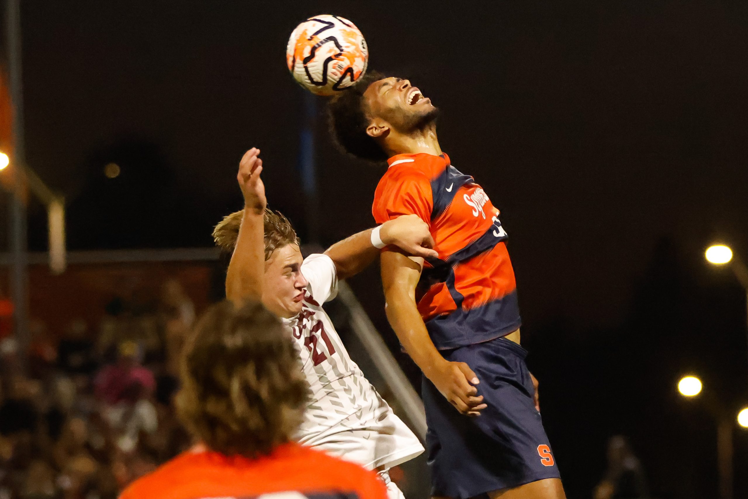 Syracuse's Josh Belluz (33) and Colgate's Charlie Yates (27) collide for the ball during a non-conference game on Tuesday, October 3, 2023 at SU Soccer Stadium.