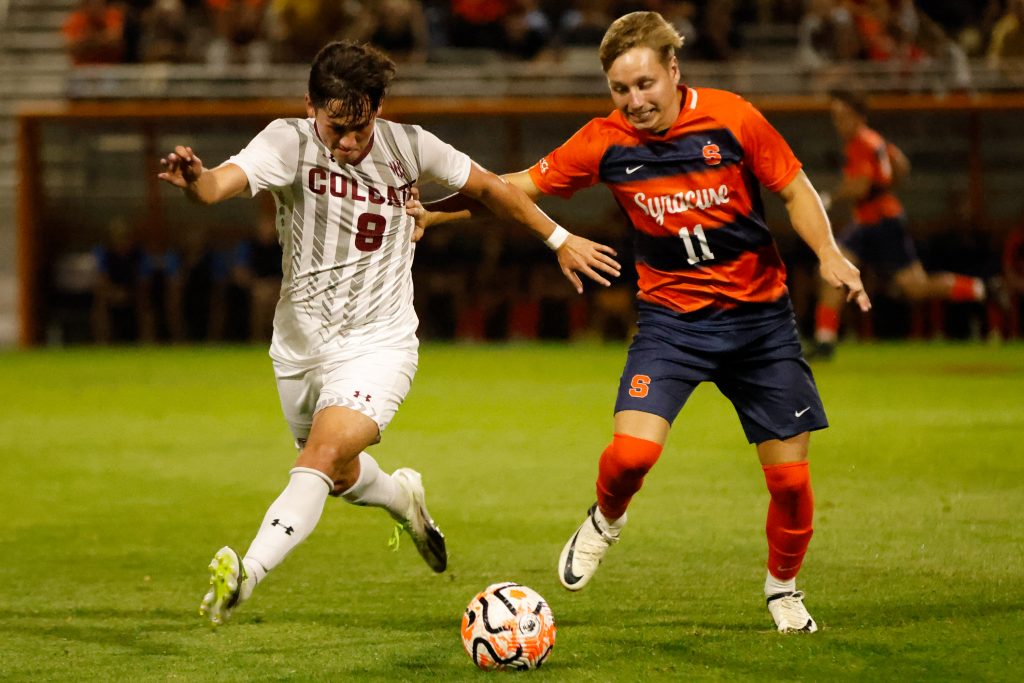 Colgate's Mason Pahule (8) and Syracuse's Felipe D'Agostini (11) compete for possession of the ball during a non-conference game on Tuesday, October 3, 2023 at SU Soccer Stadium.
