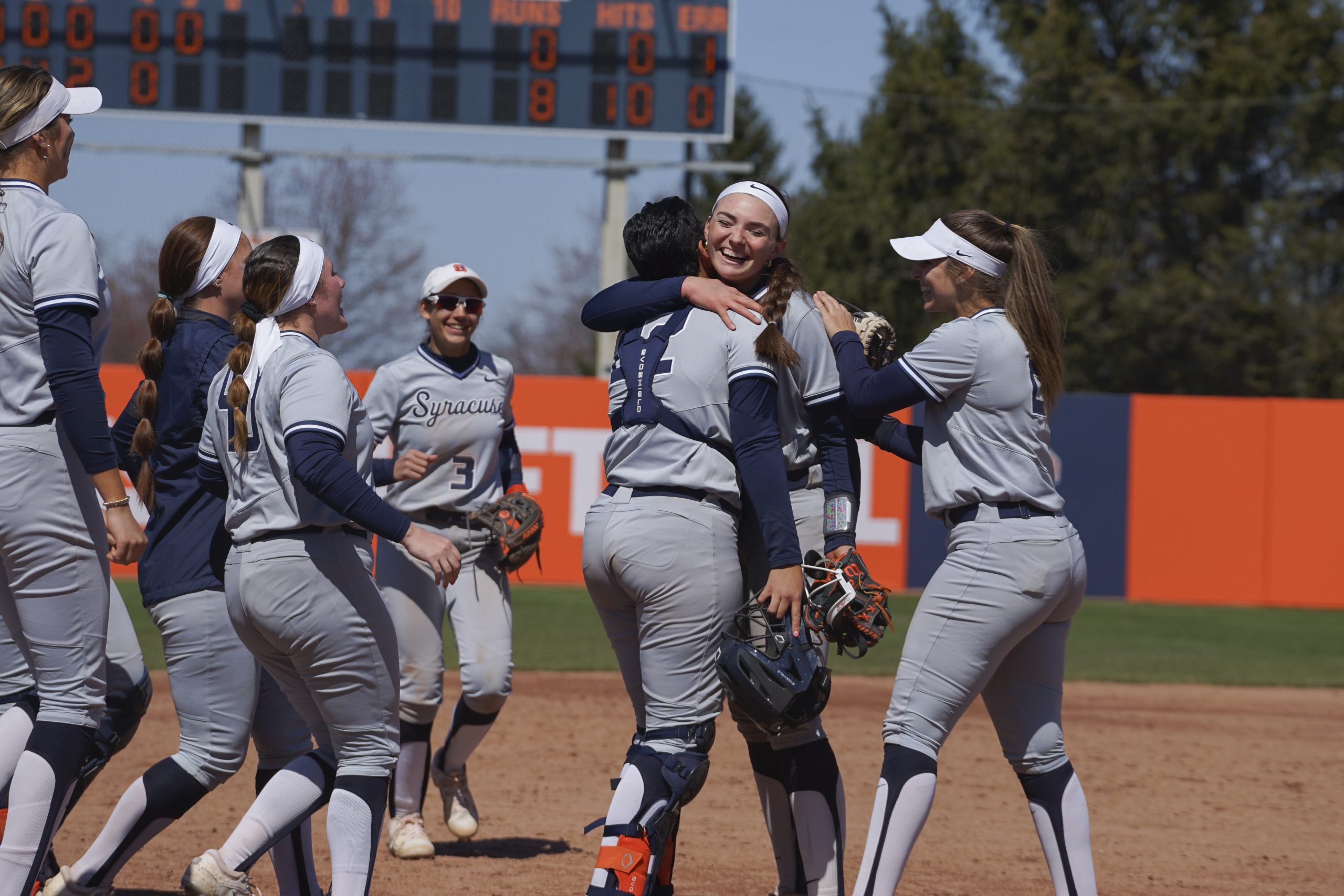 The Syracuse softball team celebrates a win against NC State on Saturday, April 8, 2023 at the Skytop Softball Stadium.