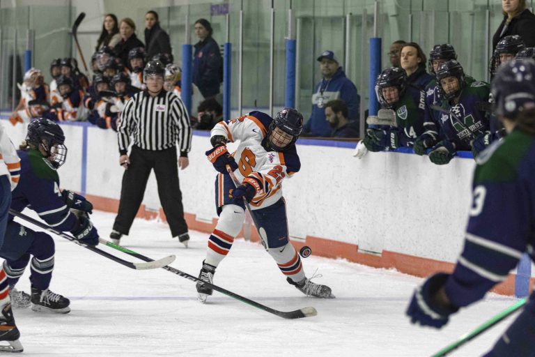 Syracuse number 22, Charlotte Hallett, launches the puck towards Mercyhurst goal February 11.
