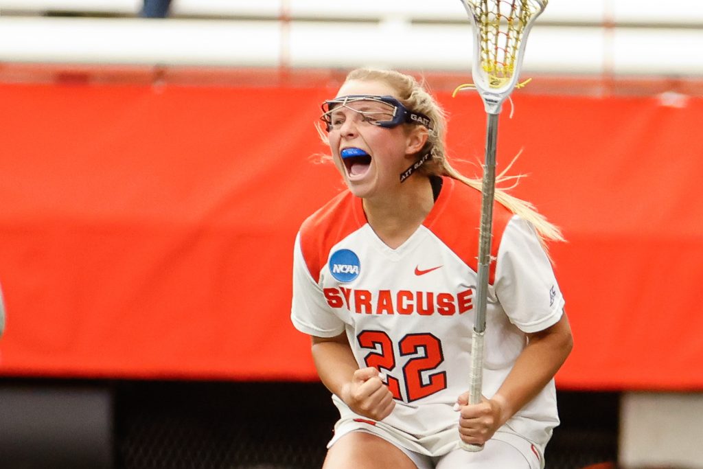 Syracuse's Megan Carney (22) celebrates a goal against James Madison University during the NCAA Tournament quarterfinal on Thursday, May 18, 2023 at JMA Wireless Dome. Photo by Kayla Breen.