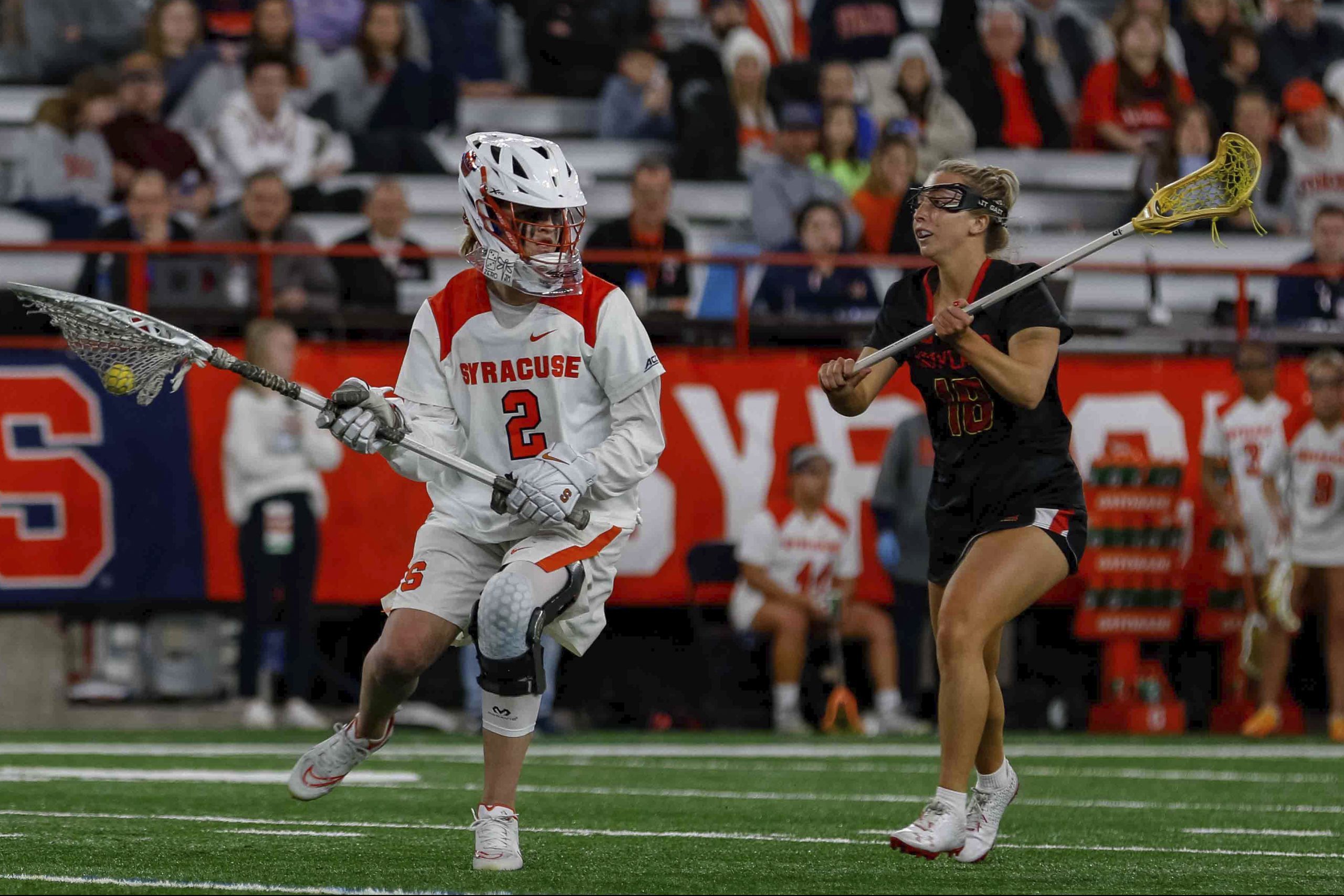 Delaney Sweitzer (2) tries to outmaneuver a Maryland defender.