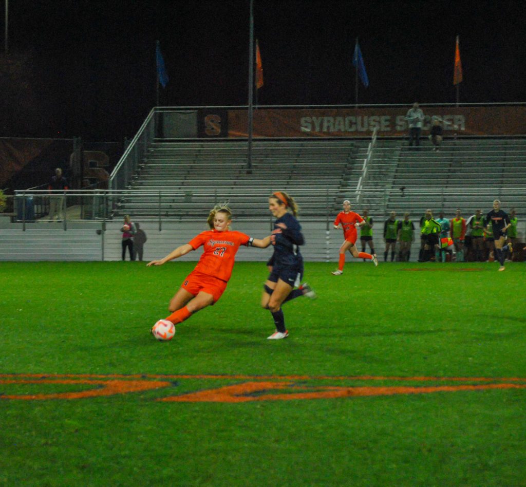 Sophomore defender Grace Gillard (#27) goes head to head with Virginia's offense at Thursday's game.