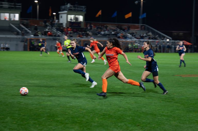 SU sophomore Alyssa Abramson (#5) races for possession at Thursday's game.